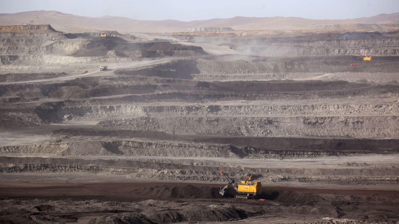Trucks driving through a coal mine in Huolin Gol, Inner Mongolia on November 15, 2010.