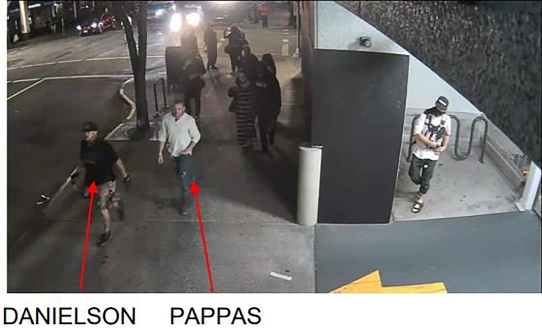 Photos taken from surveillance video shortly before the fatal shooting in Portland show Michael Reinoehl inside the entrance of a parking garage, just feet from Aaron Danielson. 