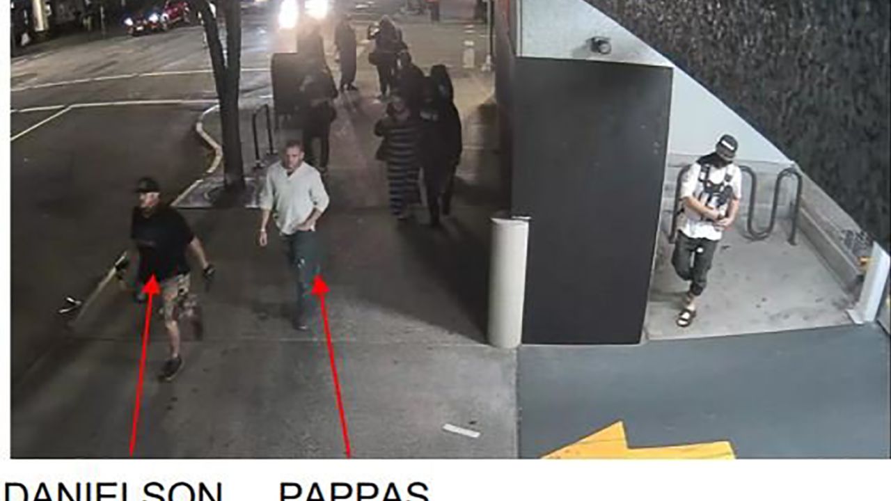 Photos taken from surveillance video shortly before the fatal shooting in Portland show Michael Reinoehl inside the entrance of a parking garage, just feet from Aaron Danielson.