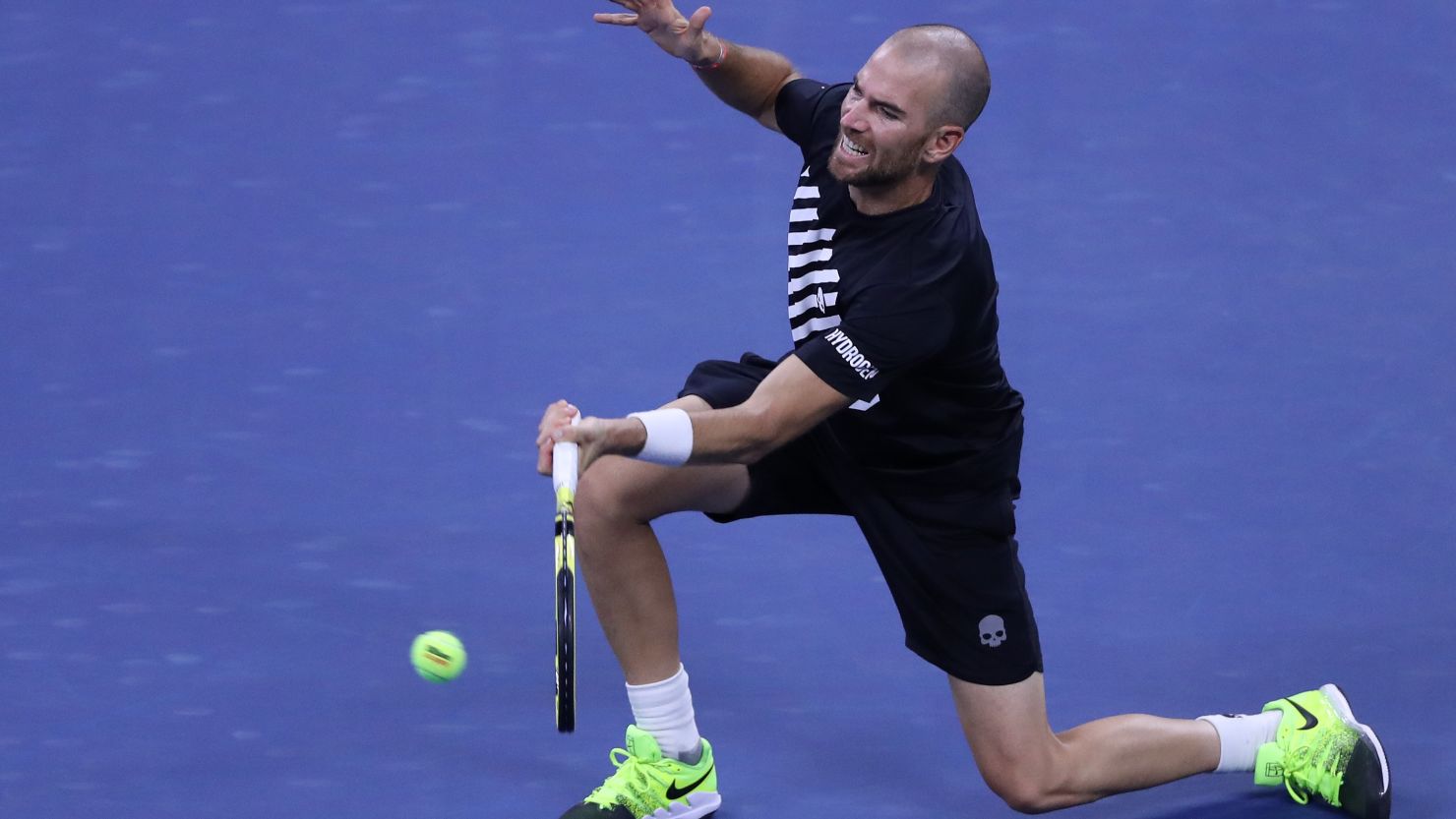 Adrian Mannarino of France returns a volley during his third round match against Alexander Zverev of Germany.