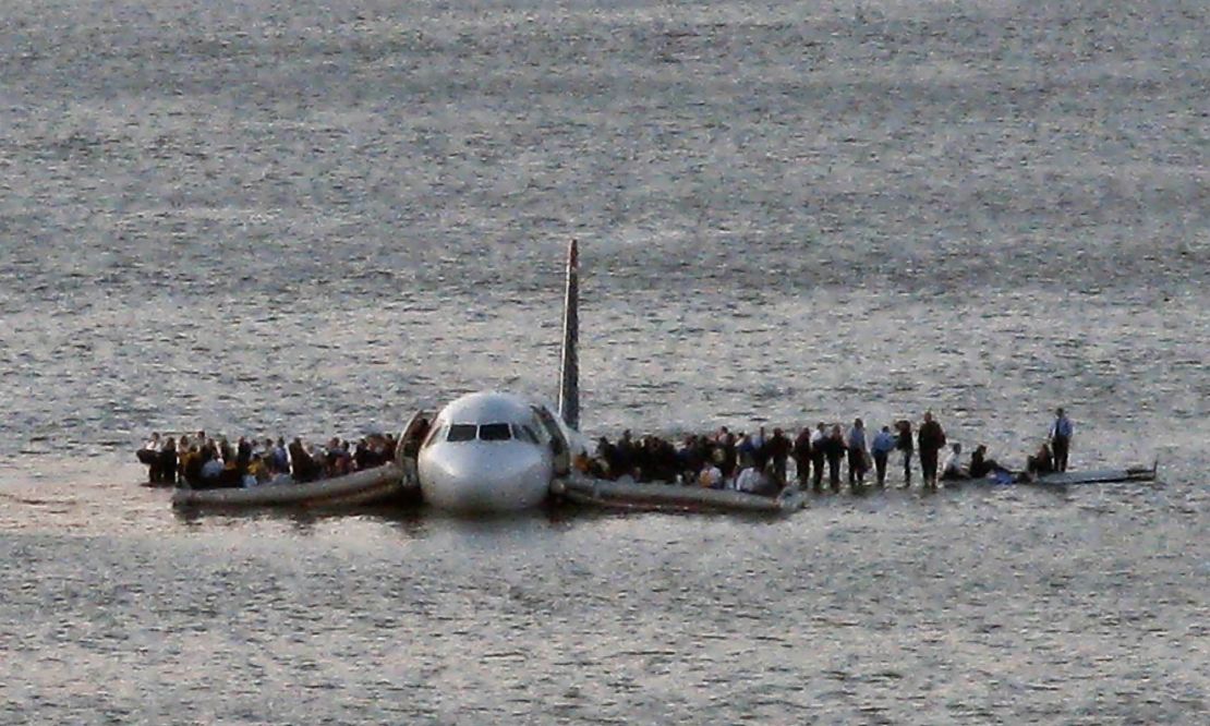 Passengers wait to be rescued on the wings of Flight 1549 after it landed in 2009 in the Hudson River.