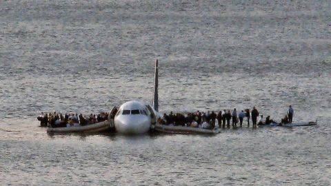Passengers wait to be rescued on the wings of Flight 1549 after it landed in 2009 in the Hudson River.