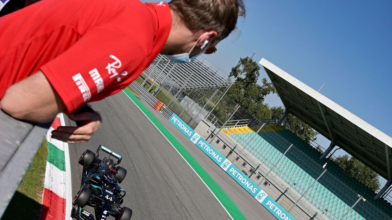 Sebastian Vettel watches his rival Lewis Hamilton secure pole position.