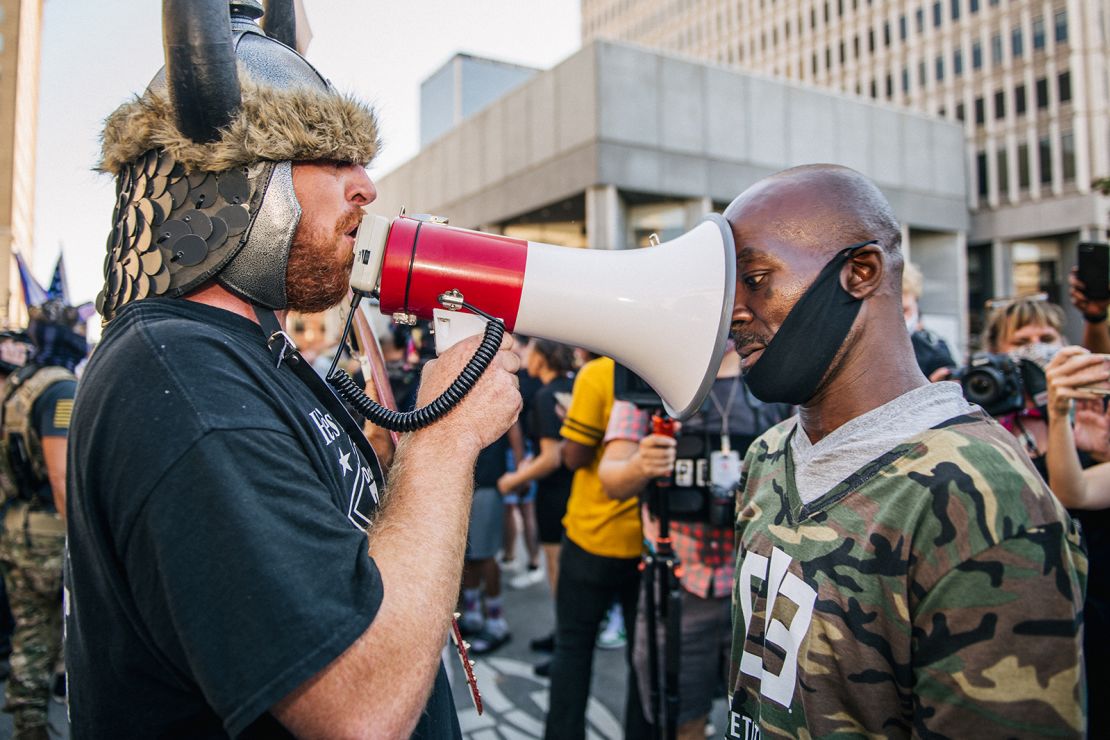 Dueling demonstrators argue outside Louisville Metro Hall on Saturday, September 5, 2020. 