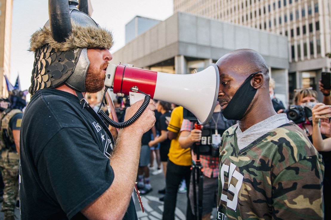 Dueling demonstrators argue outside Louisville Metro Hall on Saturday, September 5, 2020.