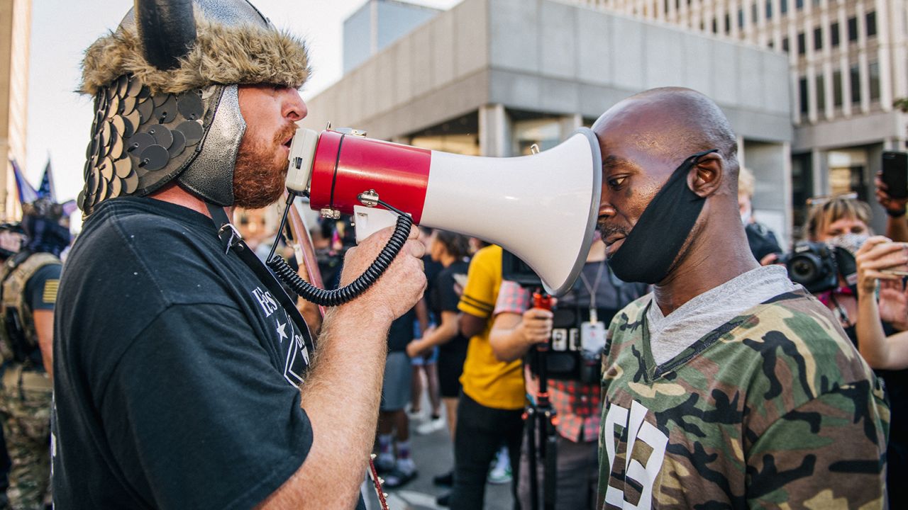 Demonstrators argue outside Louisville Metro Hall in Kentucky on September 5, 2020. Ahead of the Kentucky Derby, demonstrators clashed over recent looting and destruction in the city and the police shooting death of Breonna Taylor. 