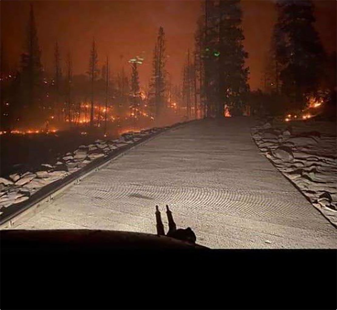 The California National Guard helped rescue those trapped by a fire that blocked the only road out.