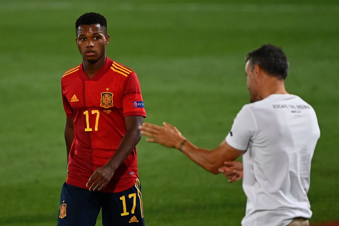 Coach Luis Enrique gives instructions to Ansu Fati during the UEFA Nations League match. 