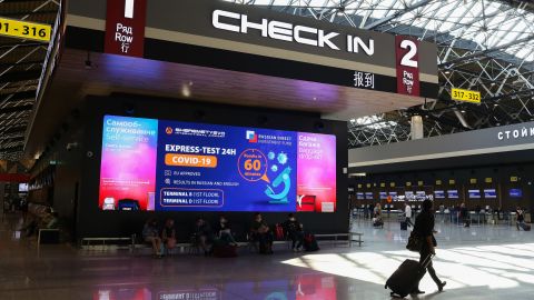 An illuminated sign advertises a 60-minute rapid covid-19 test for passengers by the check-in area inside the arrivals hall at Terminal B of Sheremetyevo International Airport OAO in Moscow, Russia, on Monday, Aug. 31, 2020. Russia became the fourth country to pass 1 million confirmed cases of Covid-19, joining the U.S., India and Brazil, on the day schools across the country reopened for the new academic year. Photographer: Andrey Rudakov/Bloomberg via Getty Images