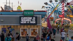OCEAN CITY, NEW JERSEY - SEPTEMBER 07: A sign reads, "Everyone is required to wear a mask" at the entrance to Playland's Castaway Cove as the state of New Jersey continues Stage 2 of re-opening following restrictions imposed to slow the spread of coronavirus on September 07, 2020 in Ocean City, New Jersey. Stage 2, allows moderate-risk activities to resume which most recently includes indoor dining, theatre and performances with limited capacity. (Photo by Alexi Rosenfeld/Getty Images)