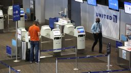 A United Airlines passenger checks in for a flight at San Francisco International Airport 