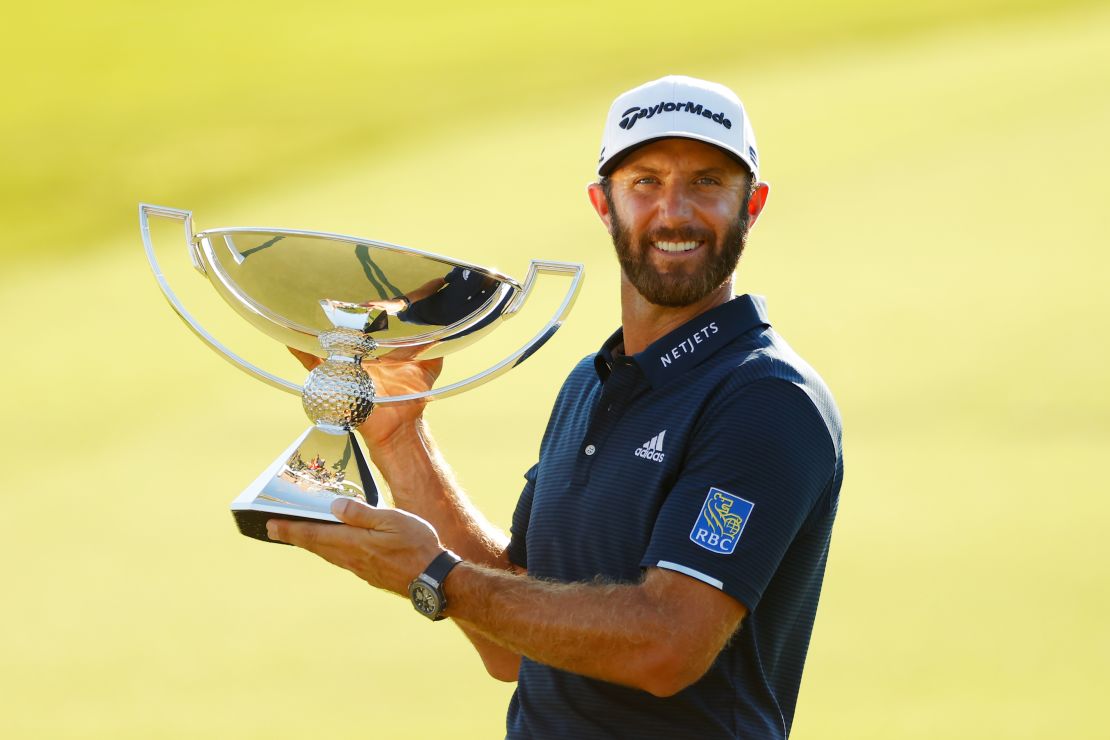 Dustin Johnson holds the FedEx Cup aloft following his Tour Championship win.