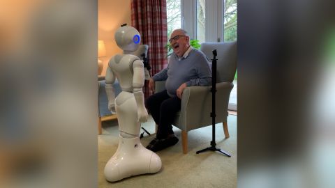 Pepper engages in conversation with a care home resident.