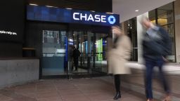 Pedestrians pass in front of a JP Morgan Chase & Co. bank branch outside Pennsylvania Station in New York, U.S., on Wednesday, Feb. 5, 2020. New York City has for decades talked about improving the neighborhood around antiquated Pennsylvania Station with the kind of development that's invigorated other parts of Manhattan. Real estate billionaire Steven Roth is finally seizing the moment. Photographer: Bess Adler/Bloomberg via Getty Images