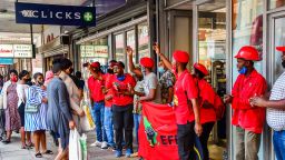 DURBAN, SOUTH AFRICA - SEPTEMBER 07: EFF Members stop public from entering a Clicks store in the CBD during the national shutdown of all Clicks outlets on September 07, 2020 in Durban, South Africa. This comes after the offensive and racist advert by Clicks that undermined the dignity of black people and suggested that the hair of black people is damaged and inferior to that of white people. (Photo by Darren Stewart/Gallo mages/Getty Images)