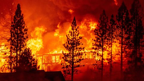 A home is engulfed in flames during the "Creek Fire" in the Tollhouse area of unincorporated Fresno County, California early on September 8, 2020. 