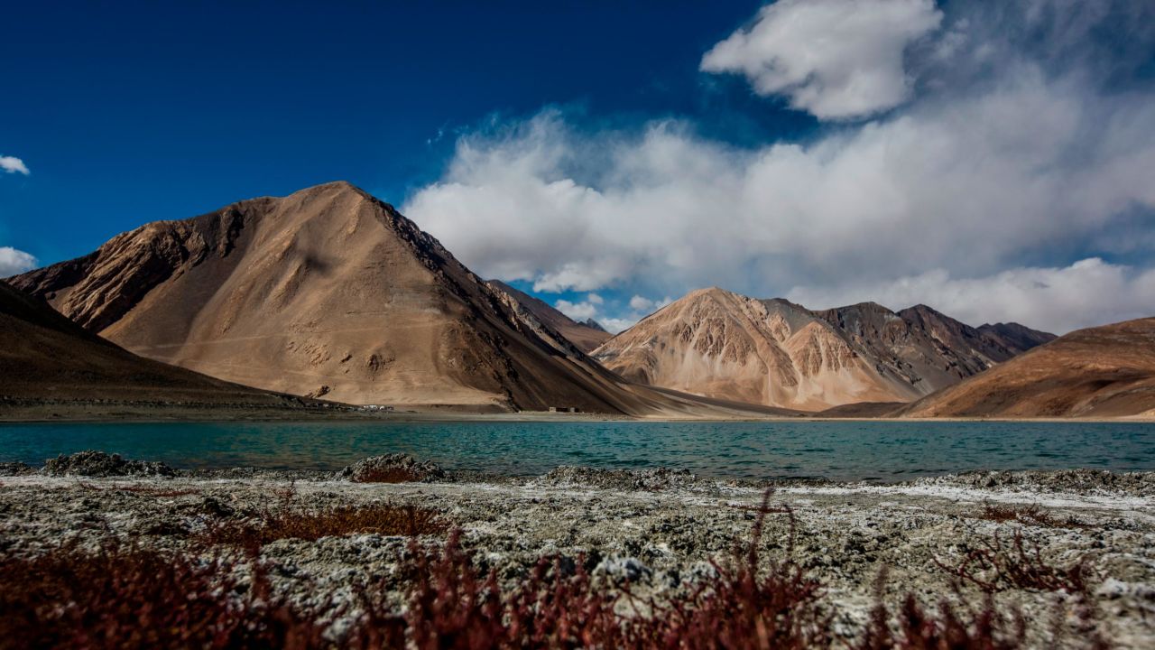 Mountains rise over the Pangong Tso Lake on October 5, 2012 near Leh in Ladakh, India.