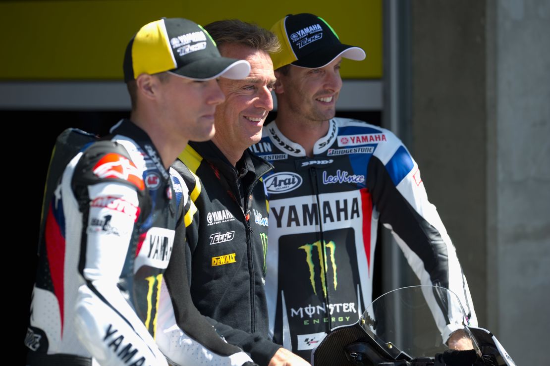 Poncharal poses with Ben Spies (left) and Colin Edwards (right).