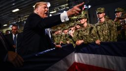 US President Donald Trump greets Marines aboard the amphibious assault ship USS Wasp (LHD 1) during a Memorial Day event in Yokosuka on May 28, 2019.         
