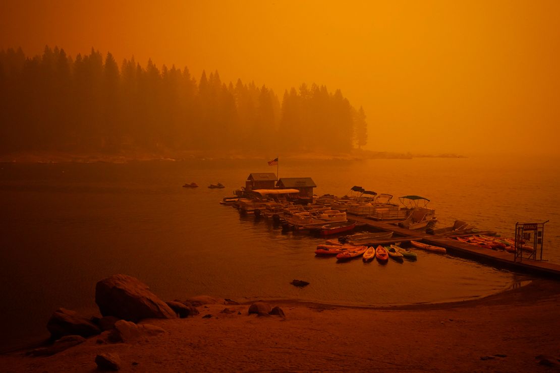 Smoke from the Creek Fire fills the air over a boating dock, Sunday, Sept. 6, 2020, in Shaver Lake, Calif.