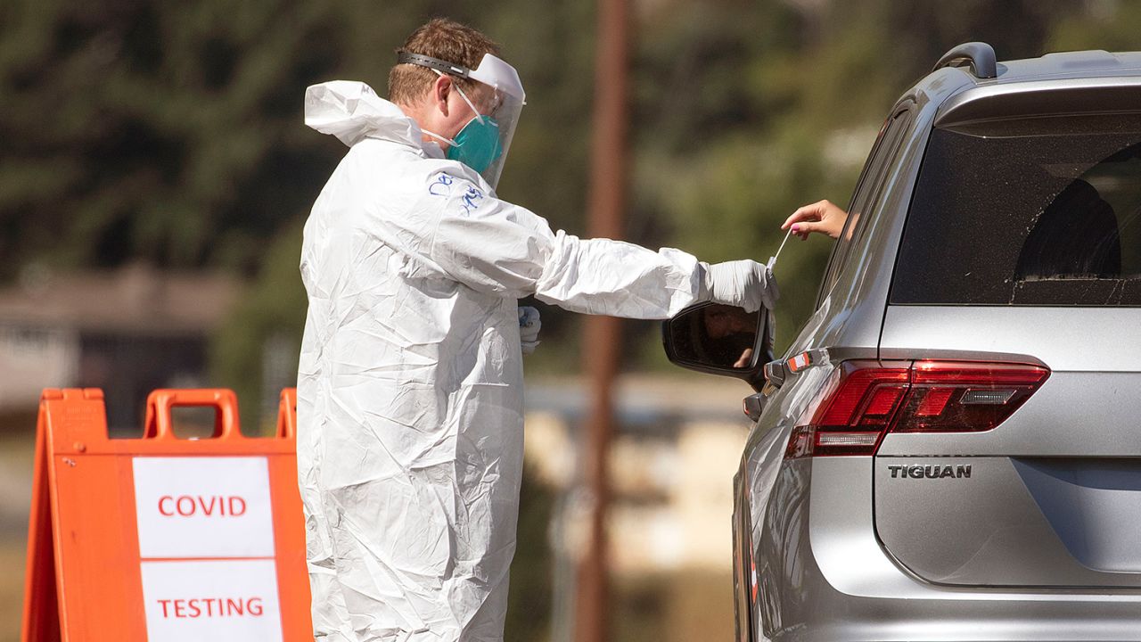 A medic takes a swab for a Covid-19 test from at a mobile test site in Pullman, Washington.
