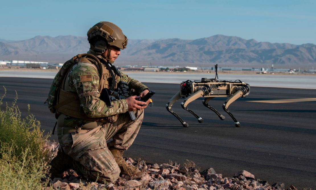 A Ghost Robotics Vision 60 unit operates with a US Air Force sergeant during an exercises at Nellis Air Force Base in Nevada.