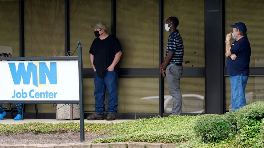 Clients line up outside the Mississippi Department of Employment Security WIN Job Center in Pearl, Miss., Monday, Aug. 31, 2020.  The U.S. economy's economic engine may be running out of fuel. Consumer spending accounts for about 70% of the U.S. gross domestic product, making it the single most important factor in recovering from one of the worst recessions on record. (AP Photo/Rogelio V. Solis)