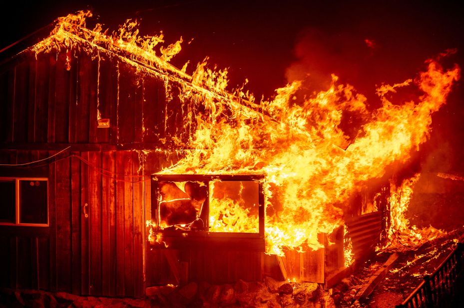 Flames shoot from a home in Butte County.