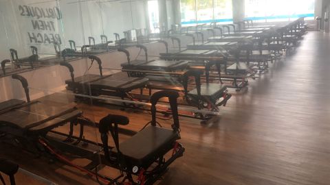 A row of Pilates-related exercise machines is pictured at an SLT fitness studio location in Southampton, New York studio on September 8, 2020.