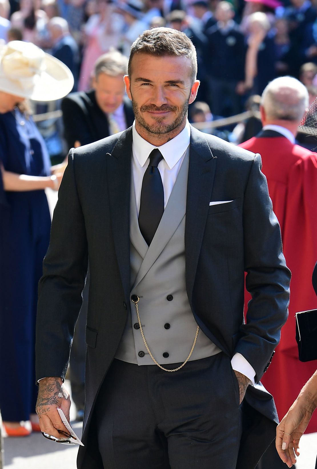 David Beckham wearing a Kim Jones-designed morning suit to the wedding ceremony of Prince Harry, Duke of Sussex and Meghan, Duchess of Sussex