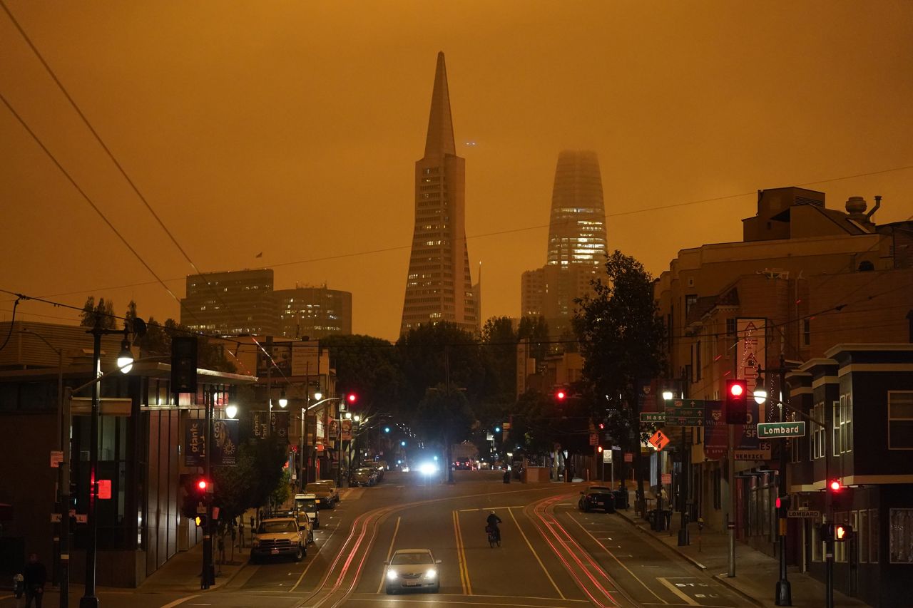 Looking up San Francisco's Columbus Avenue, the Transamerica Pyramid and Salesforce Tower are covered with smoke from nearby wildfires on September 9, 2020. This photo was taken in the late morning.