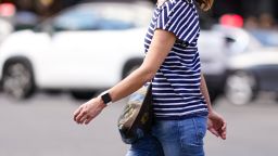 PARIS, FRANCE - JULY 11: A passerby wears a blue and white striped t-shirt, blue jeans, an Apple watch, on July 11, 2020 in Paris, France. (Photo by Edward Berthelot/Getty Images)
