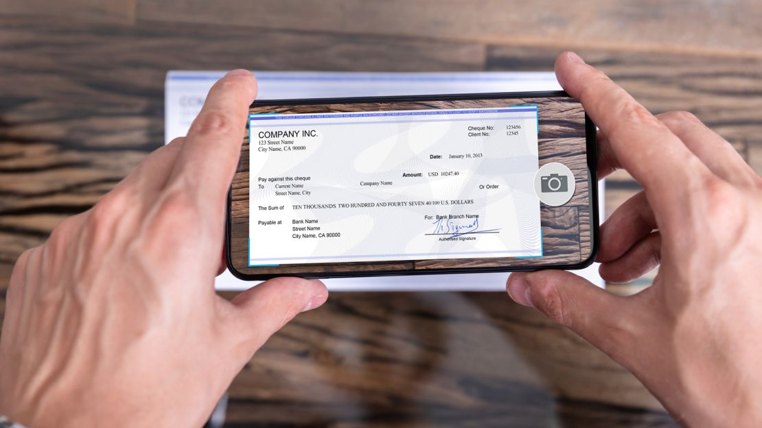 Person depositing a check with their smartphone.