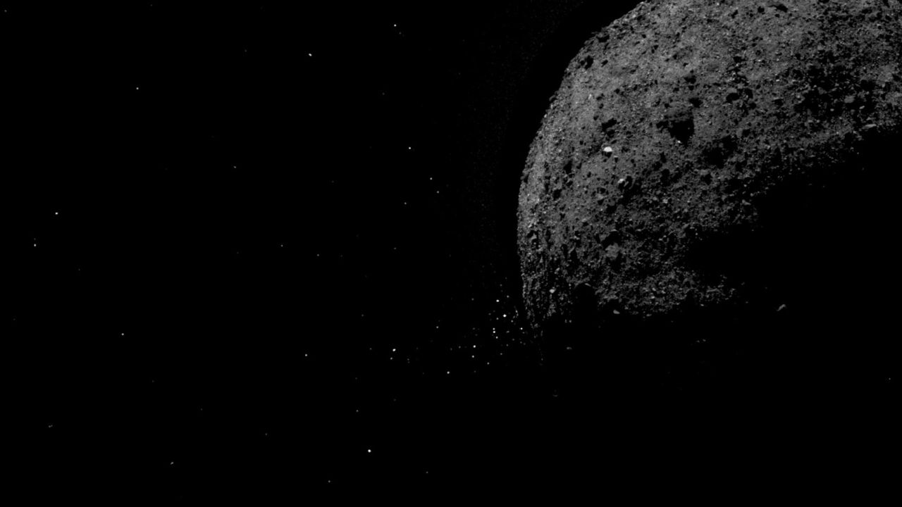 This image shows asteroid Bennu ejecting rock particles from its surface on Jan. 19, 2019. 