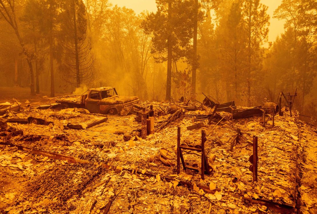 A burned residence smolders during the Bear fire, part of the North Lightning Complex fires, in unincorporated Butte County, California on September 9, 2020.