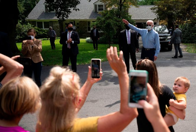 Biden speaks to supporters from a distance after meeting with labor leaders in Lancaster, Pennsylvania, in September 2020. Because of the coronavirus pandemic, Biden has taken <a href="index.php?page=&url=https%3A%2F%2Fwww.cnn.com%2F2020%2F09%2F15%2Fpolitics%2Fgallery%2Ftrump-biden-2020-campaigns%2Findex.html" target="_blank">a careful approach to campaigning</a>.