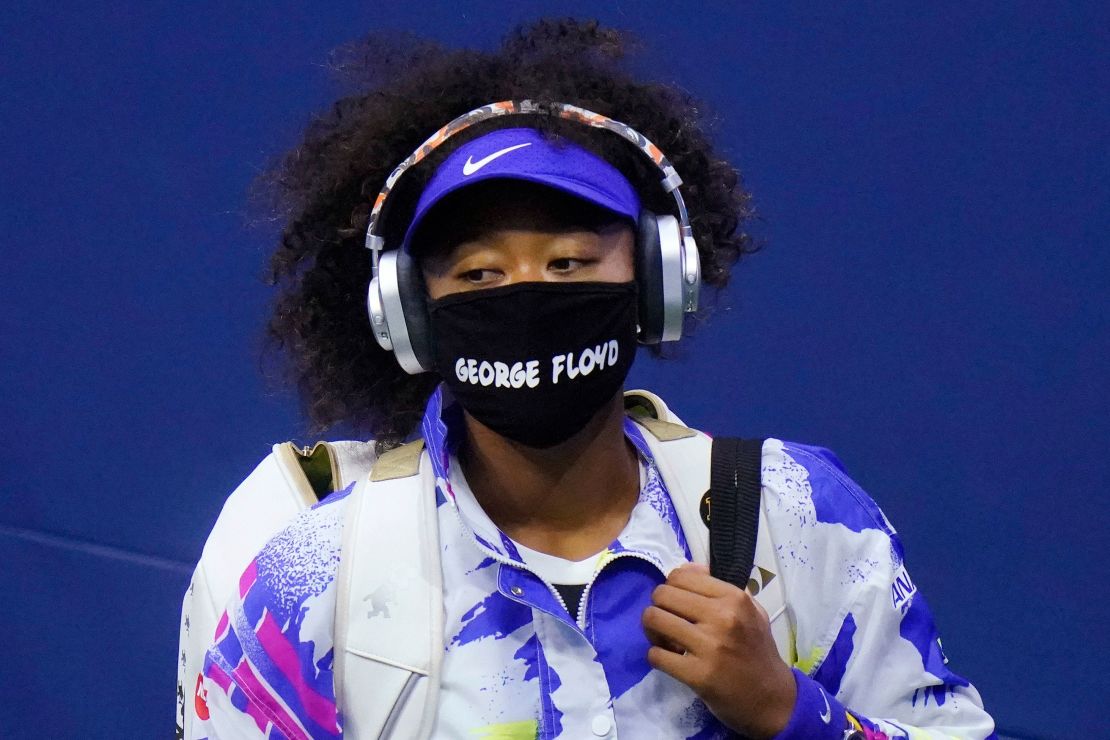 Osaka wears a face mask bearing Floyd's name before her match against Shelby Rogers.