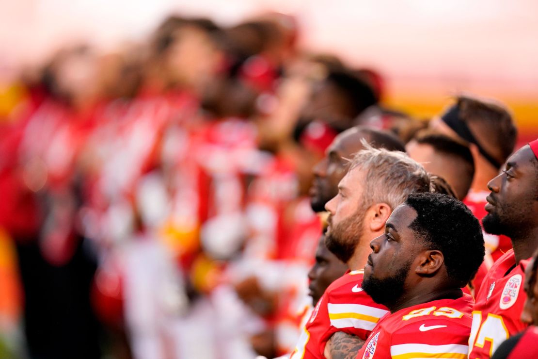 Kansas City Chiefs players stand for a presentation on social justice before an NFL football game against the Houston Texans Thursday, Sept. 10, 2020, in Kansas City, Mo.