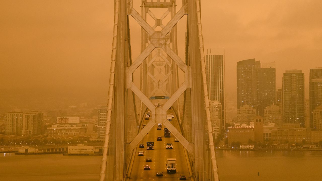 Smoke from California wildfires hangs over the San Francisco - Oakland Bay Bridge in San Francisco, California, U.S., on Wednesday, Sept. 9, 2020.