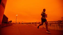 SAN FRANCISCO, CA - SEPTEMBER 9: People jog along Embarcadero as smoky skies from the northern California wildfires casts a reddish color during the morning in San Francisco, Calif., on Wednesday, Sept. 9, 2020. (Photo by Ray Chavez/MediaNews Group/The Mercury News via Getty Images)