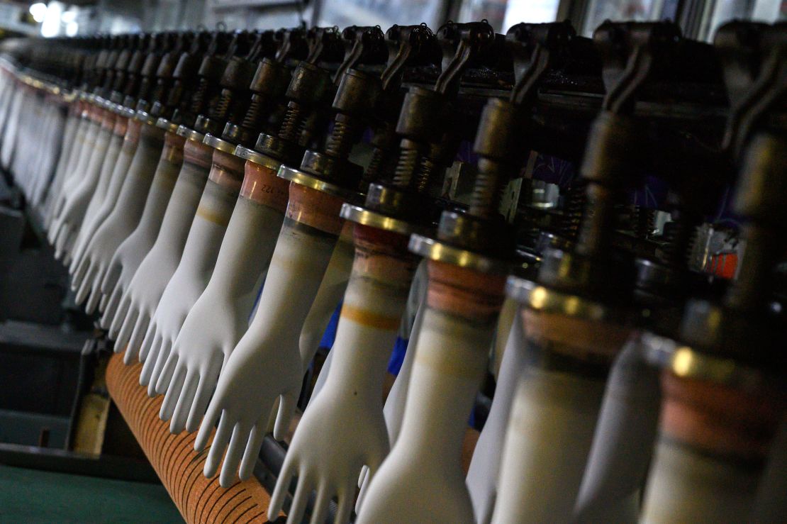 Gloves on the production line at Top Glove's factory in Shah Alam on the outskirts of Kuala Lumpur, August 26, 2020.