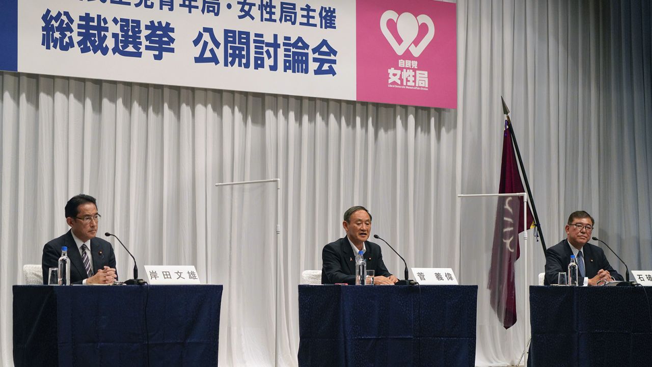 Japanese Chief Cabinet Secretary Yoshihide Suga (center) speaks during an online debate for the ruling Liberal Democratic Party's presidential election alongside former Foreign Minister Fumio Kishida (left) and former Defence Minister Shigeru Ishiba on Wednesday.