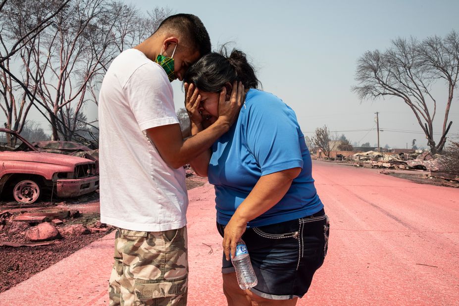 Dora Negrete is consoled by her son Hector Rocha after seeing their destroyed mobile home in Talent, Oregon, on September 10, 2020.