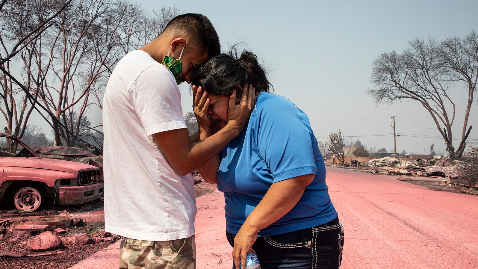 Dora Negrete is consoled by her son Hector Rocha after seeing their destroyed mobile home in Talent, Oregon, on September 10, 2020.