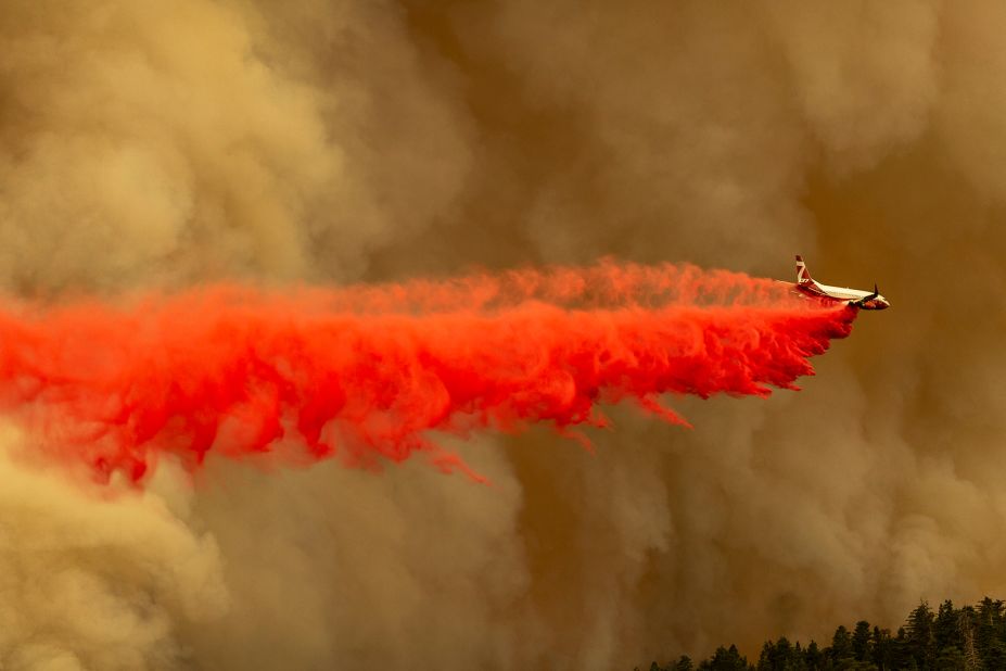 A tanker jet drops fire retardant to slow the Bobcat Fire in the Angeles National Forest north of Monrovia, California, on September 10, 2020.