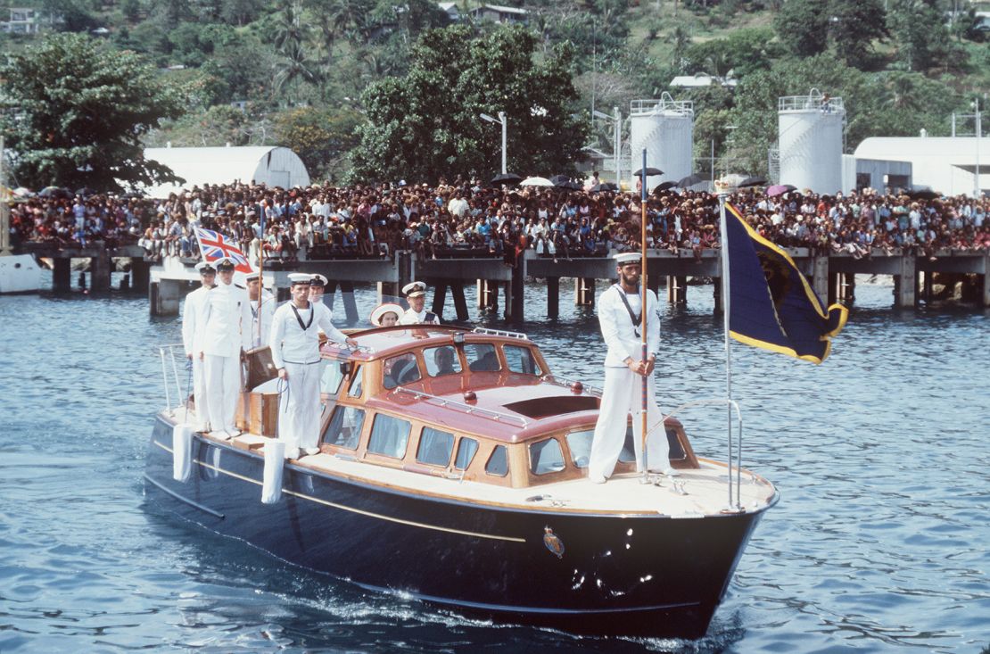 The Queen And Prince Philip arriving in Honiara on the Royal Barge on October 18, 1982. 