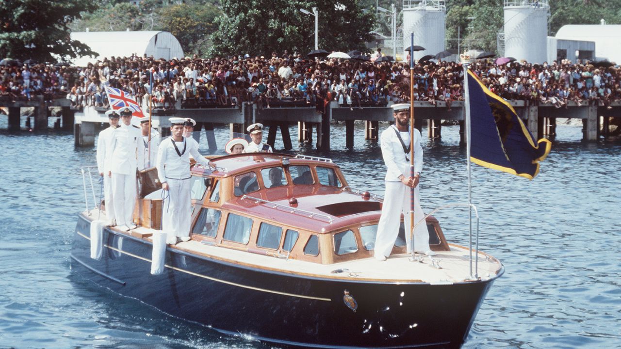 The Queen And Prince Philip arriving in Honiara on the Royal Barge on October 18, 1982. 