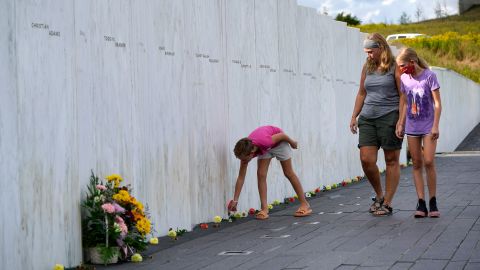 Madison, left, Lisa, center, and Natalie Grudowski of North Versailles, Pa., visit the Wall of Names at the Flight 93 National Memorial in Shanksville.