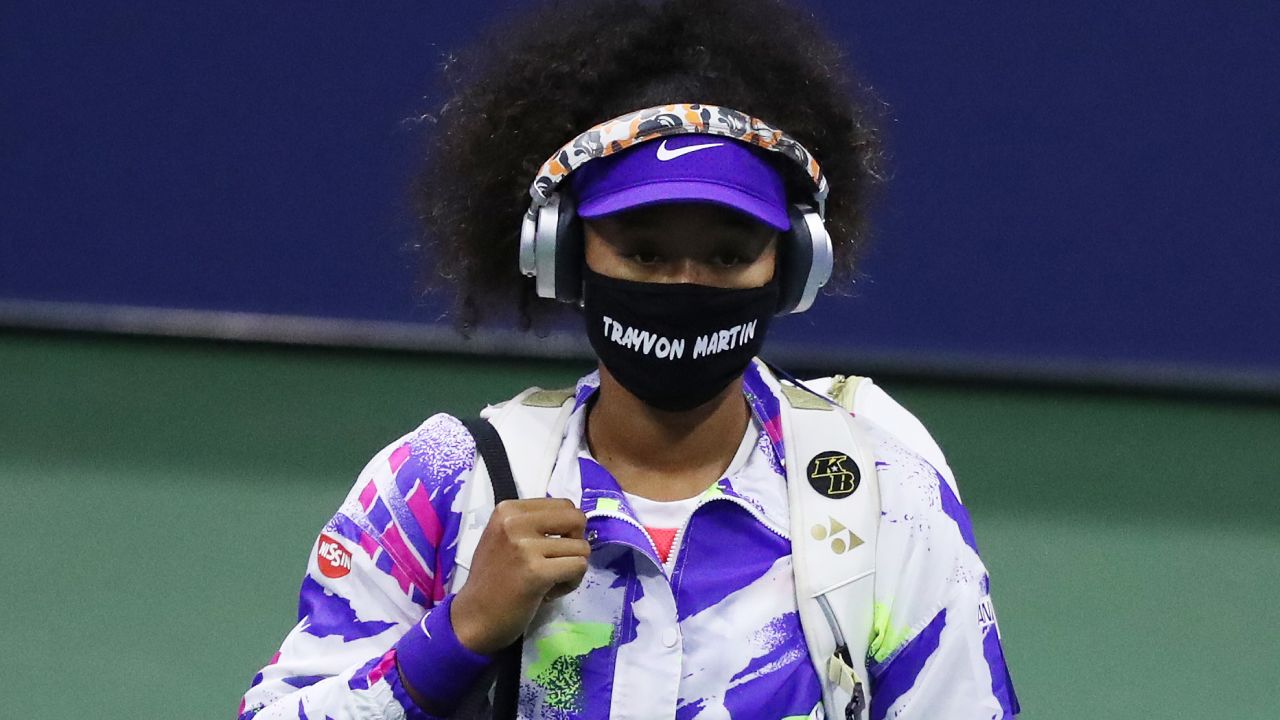 Osaka walks out wearing a mask with Martin's name before taking on Anett Kontaveit.