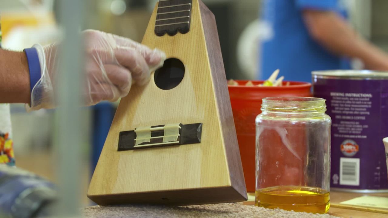 A triangle ukulele crafted by students at "Culture of Recovery."
